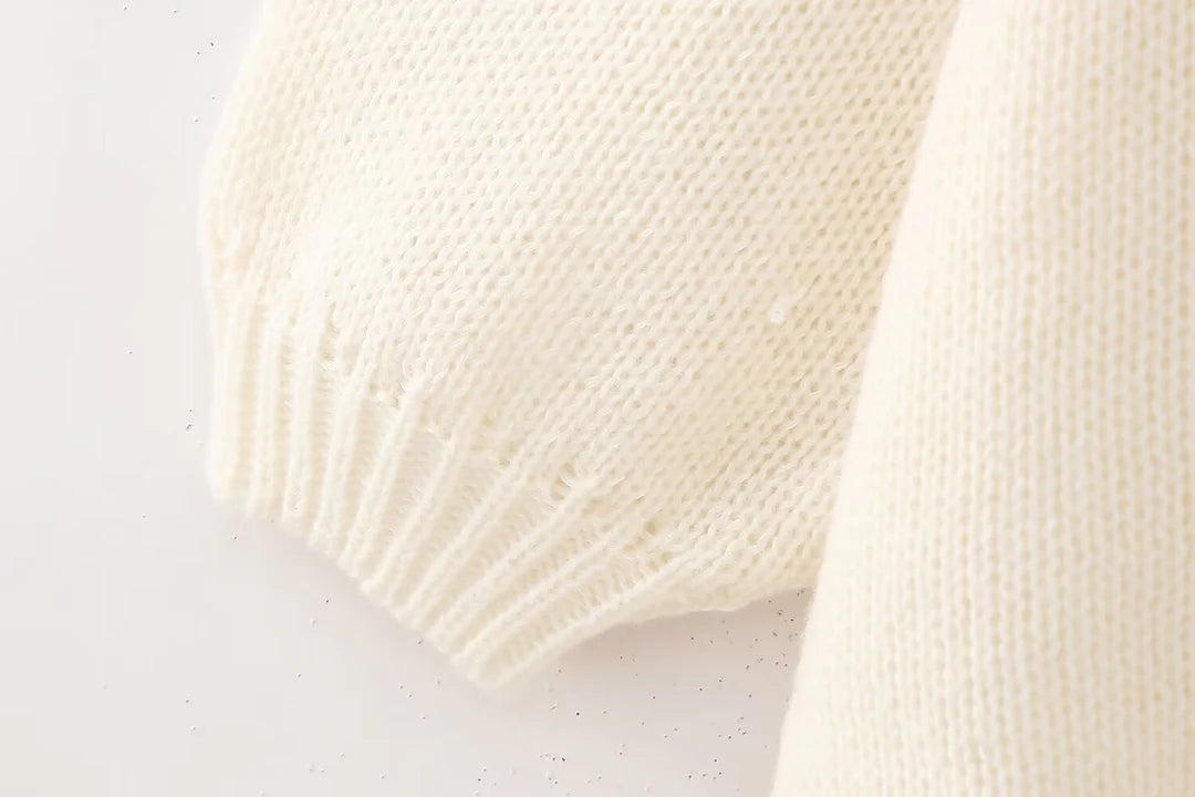 Pullover mit goldenen Knöpfen